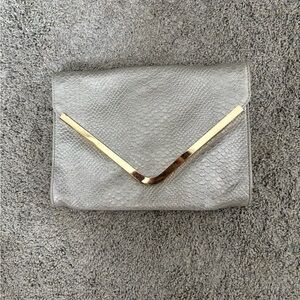 Guess Silver Clutch with Gold Detail and Removable Strap 💜